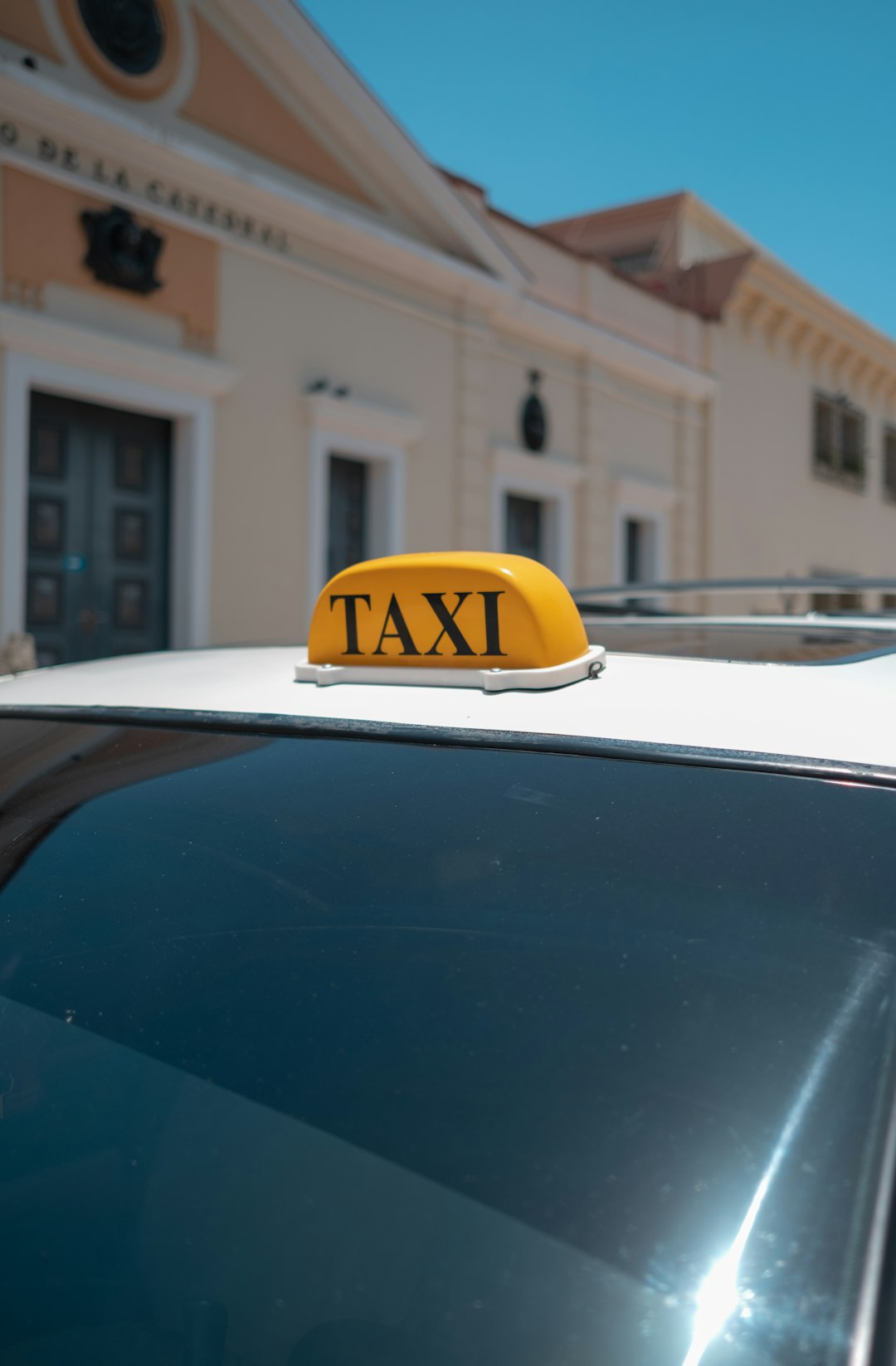services-img-03 a-taxi-cab-with-a-yellow-taxi-sign-on-top-of-it-lxtafitbz5g